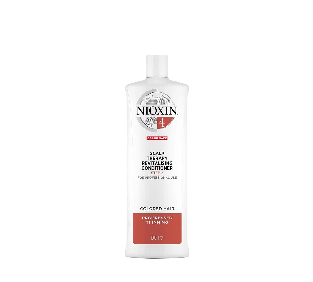 Large 1000ml white bottle of Nioxin 4 Scalp Therapy Revitalizing Conditioner with a pump dispenser, designed for color-treated hair with progressed thinning.
