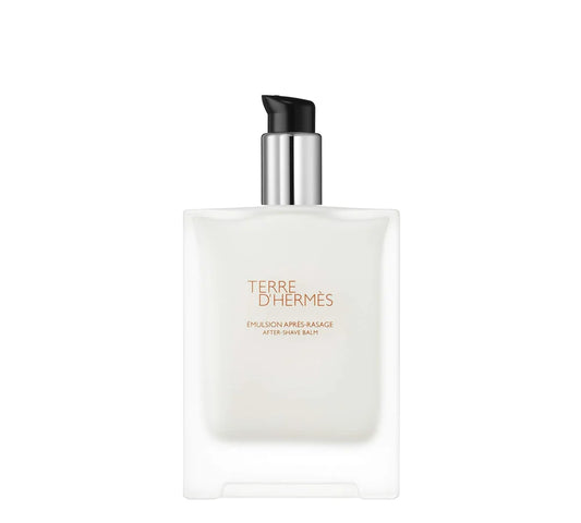 Hermes Emulsion A.RASAGE FLACON: Simple and sleek Hermes aftershave bottle with a light orange cap.