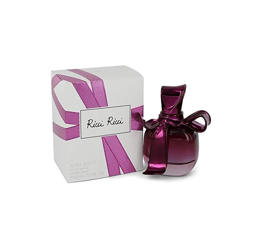 Nina Ricci Ricci Eau de Parfum 50 ml: Nina Ricci perfume in an elegant, deep pink bottle with a ribbon-shaped cap.