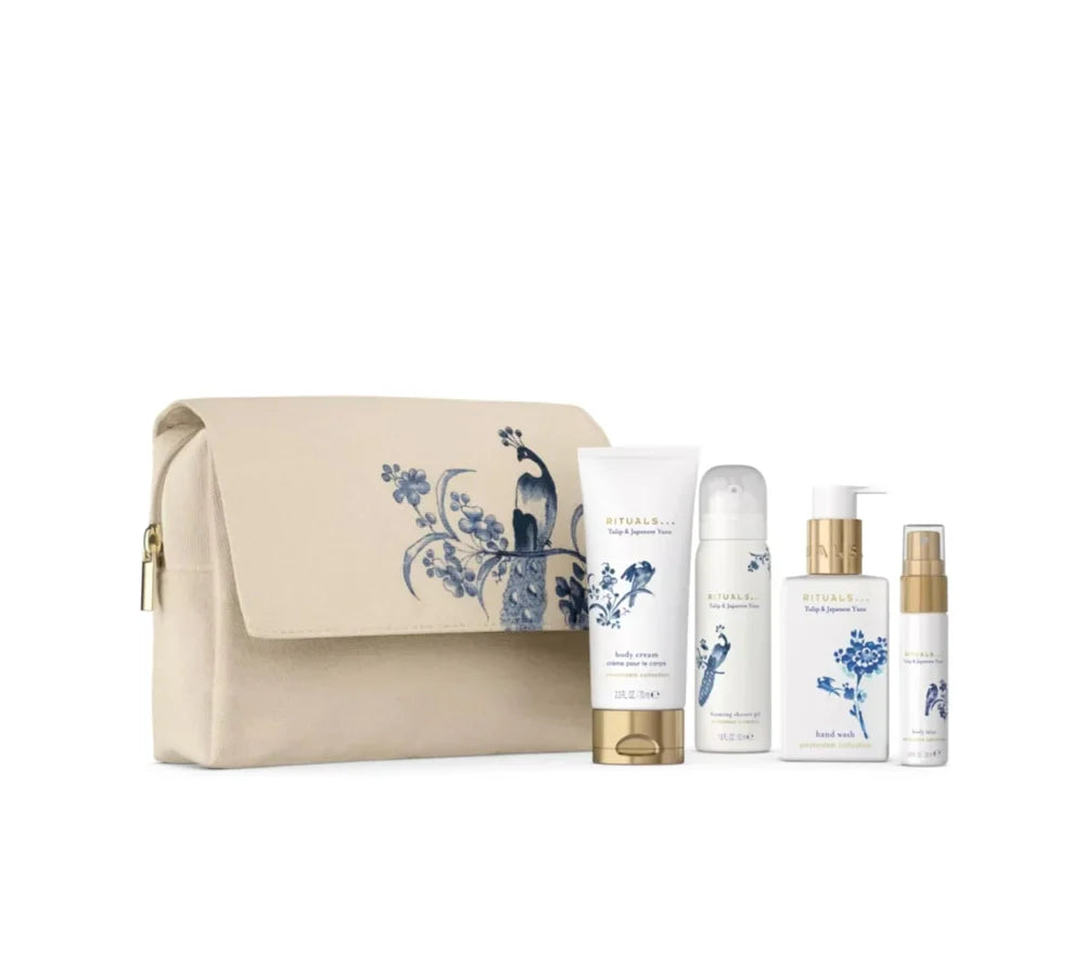 RITUALS Amsterdam Collection Gift Pouch containing four travel-sized body care products in a decorative blue and white toile-style pouch.